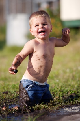 Boy Playing in the Mud