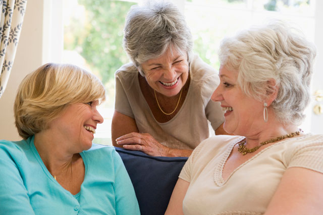 Photo of three friends chatting