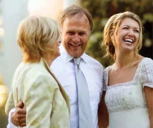 Mother, father, and daughter laughing