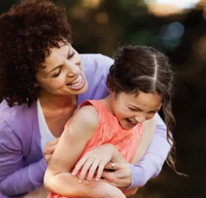 Moth tickling her daughter