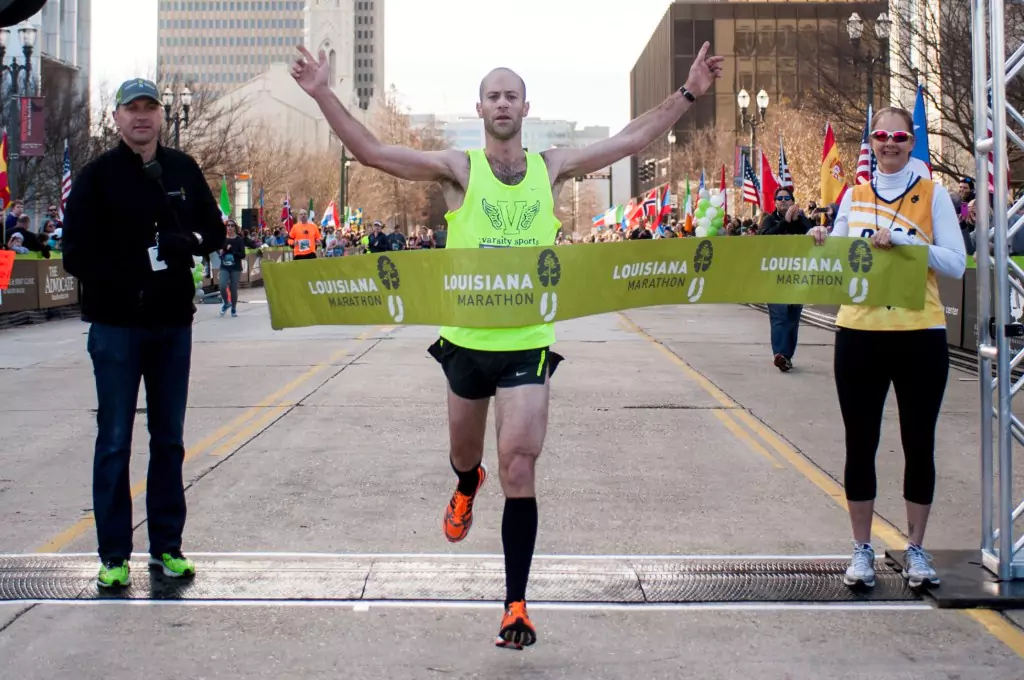 Melaleuca customer Adam MacDowell as he crosses the finish line