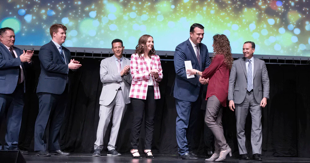 Melaleuca Execrative team shaking hands with bonus recipient