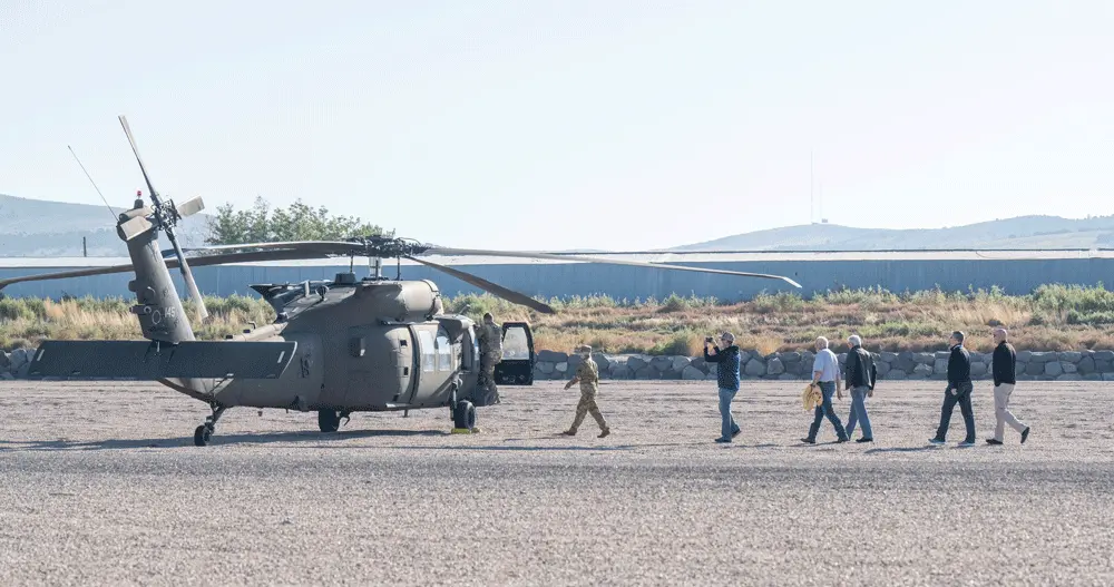 Melaleuca IT Director James Andersen steps aboard a Black Hawk helicopter that is part of the Idaho National Guard.