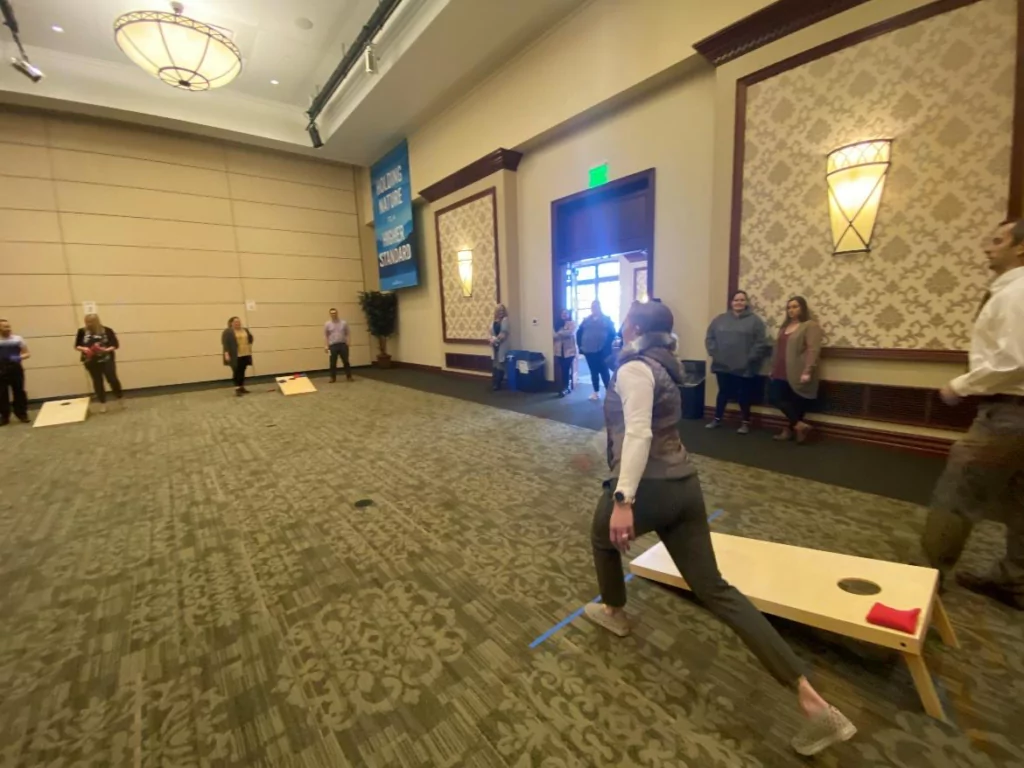 melaleuca employees playing cornhole