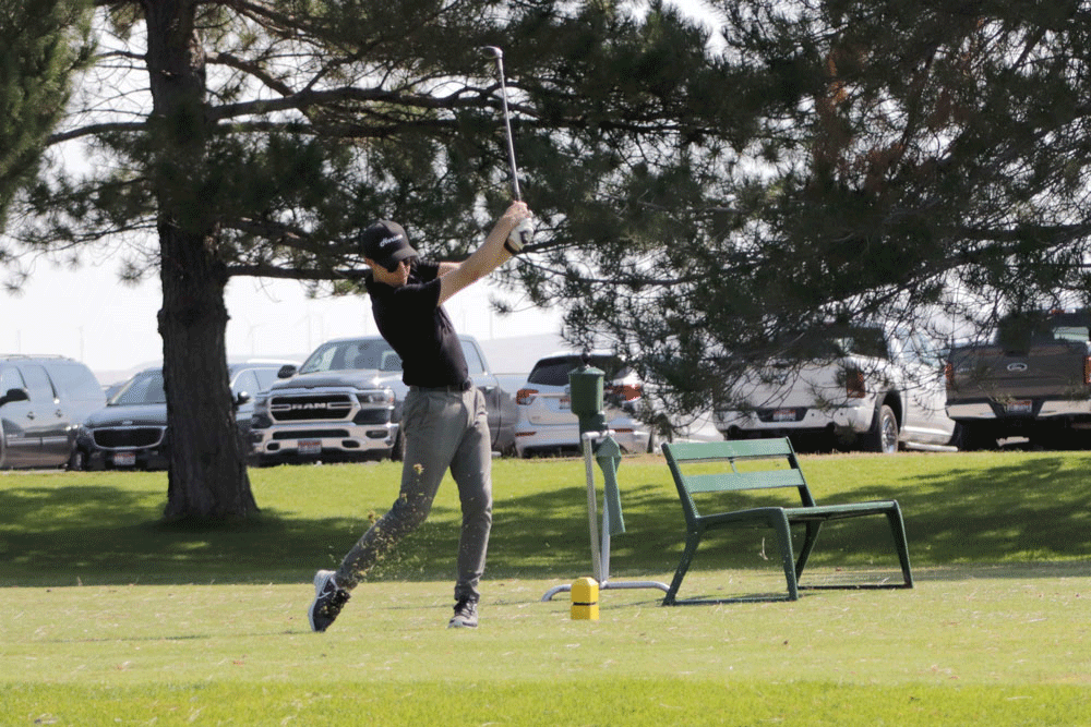 Man driving a golf ball