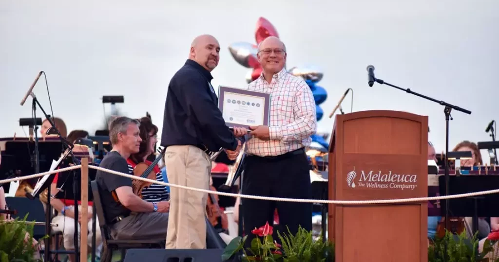 Frank VanderSloot receiving Seven Seals Award