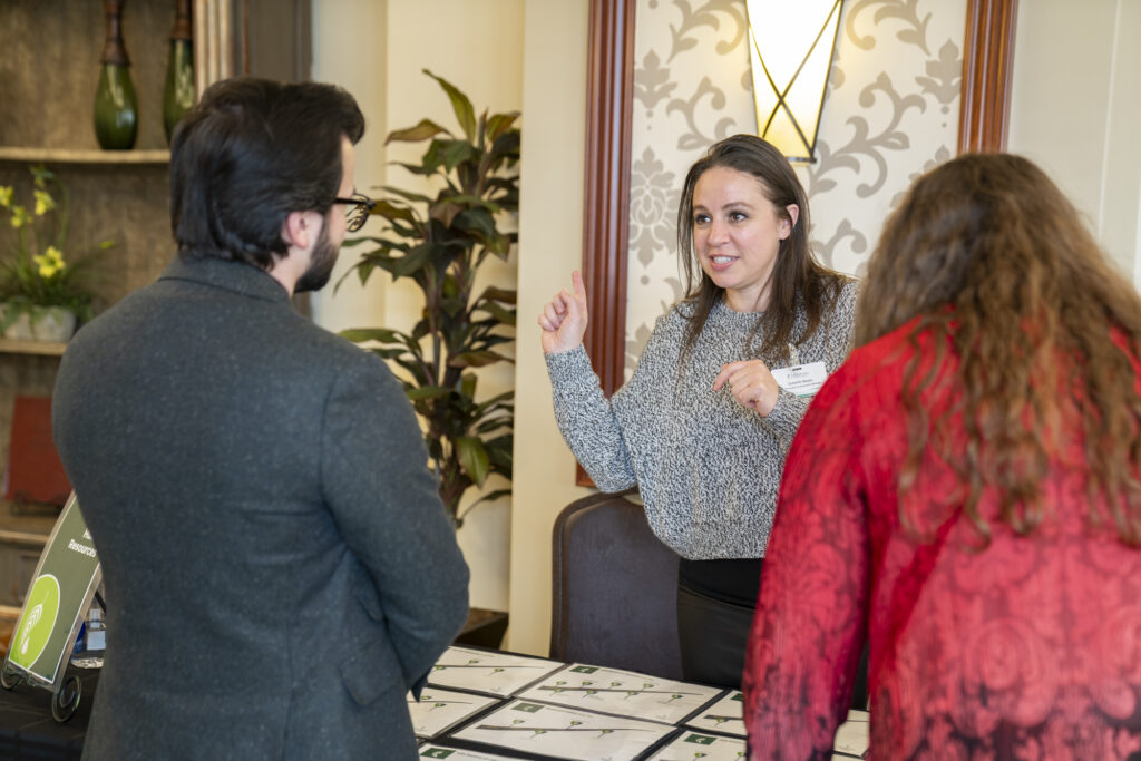 Melaleuca Team Member Danielle Noyes speaks to a candidate at the Melaleuca career fair.