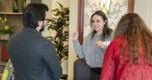 Melaleuca Team Member Danielle Noyes speaks to a candidate at the Melaleuca career fair.