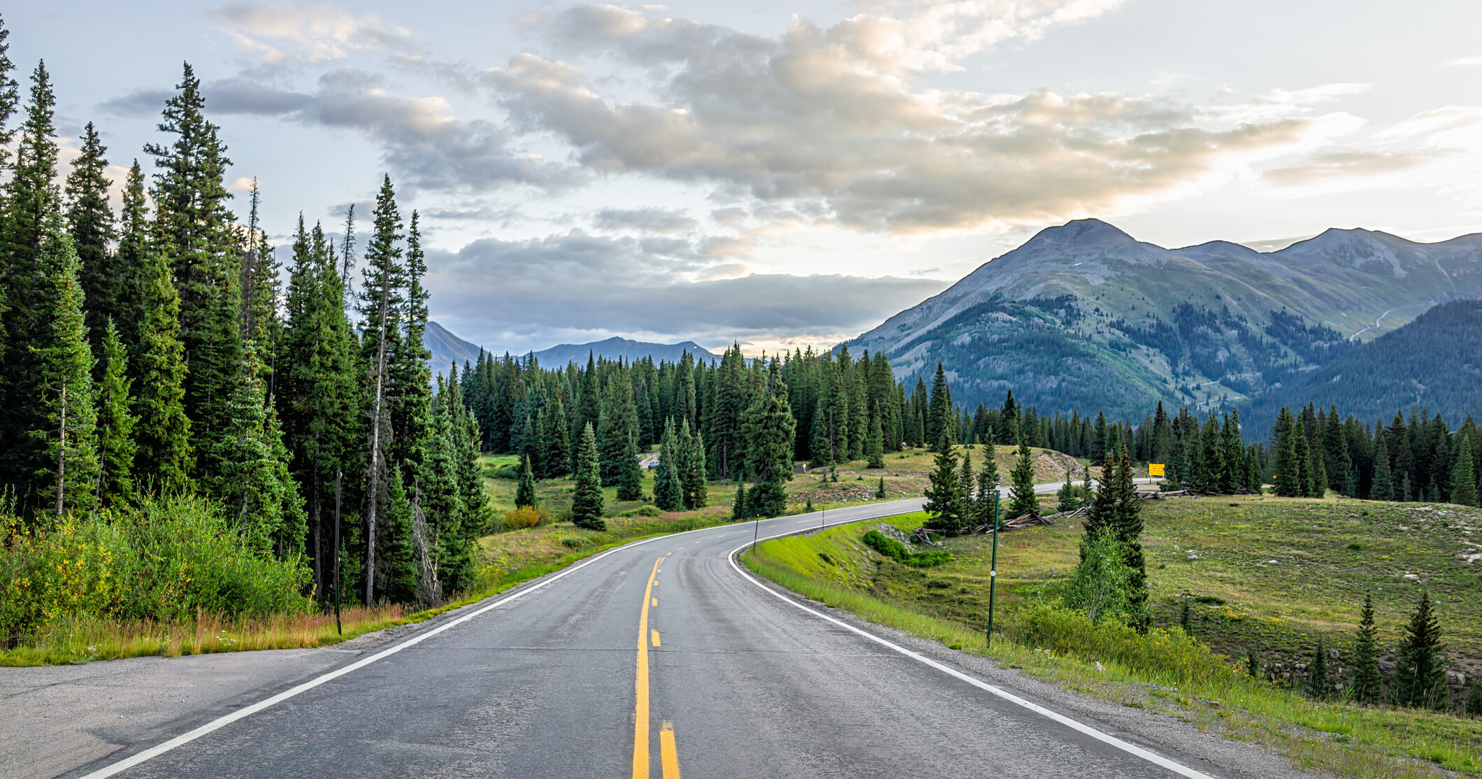San Juan mountain range in Silverton, Colorado summer morning point of view from empty highway road to Durango in Rocky Mountains