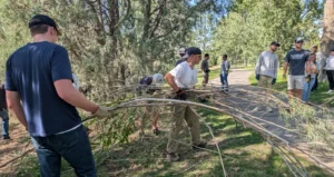Melaleuca Team Members clear brush during Idaho Falls River Walk cleanup